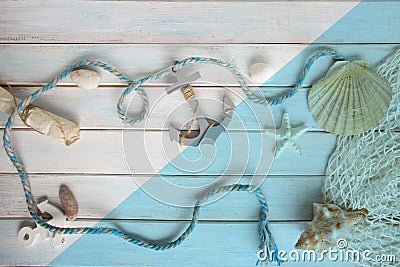 Sea â€‹â€‹shells, anchor, blue cord, white fishing net, starfish, pebbles, still life, summer vacation concept, trip to warm Stock Photo